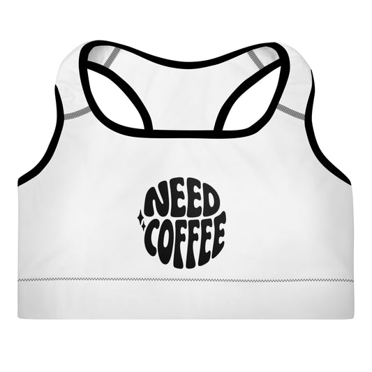 White padded sports bra with “Need Coffee” graphic on front