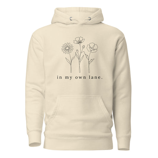 Beige hoodie with floral design and text on a white background