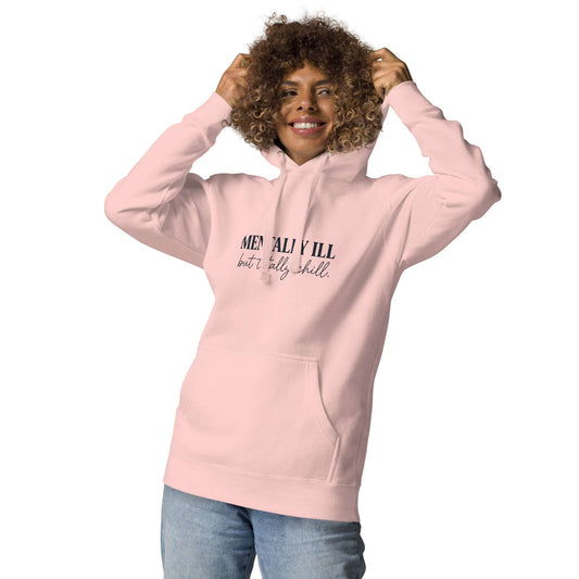 Person wearing a pink hoodie with a graphic design and text on a white background