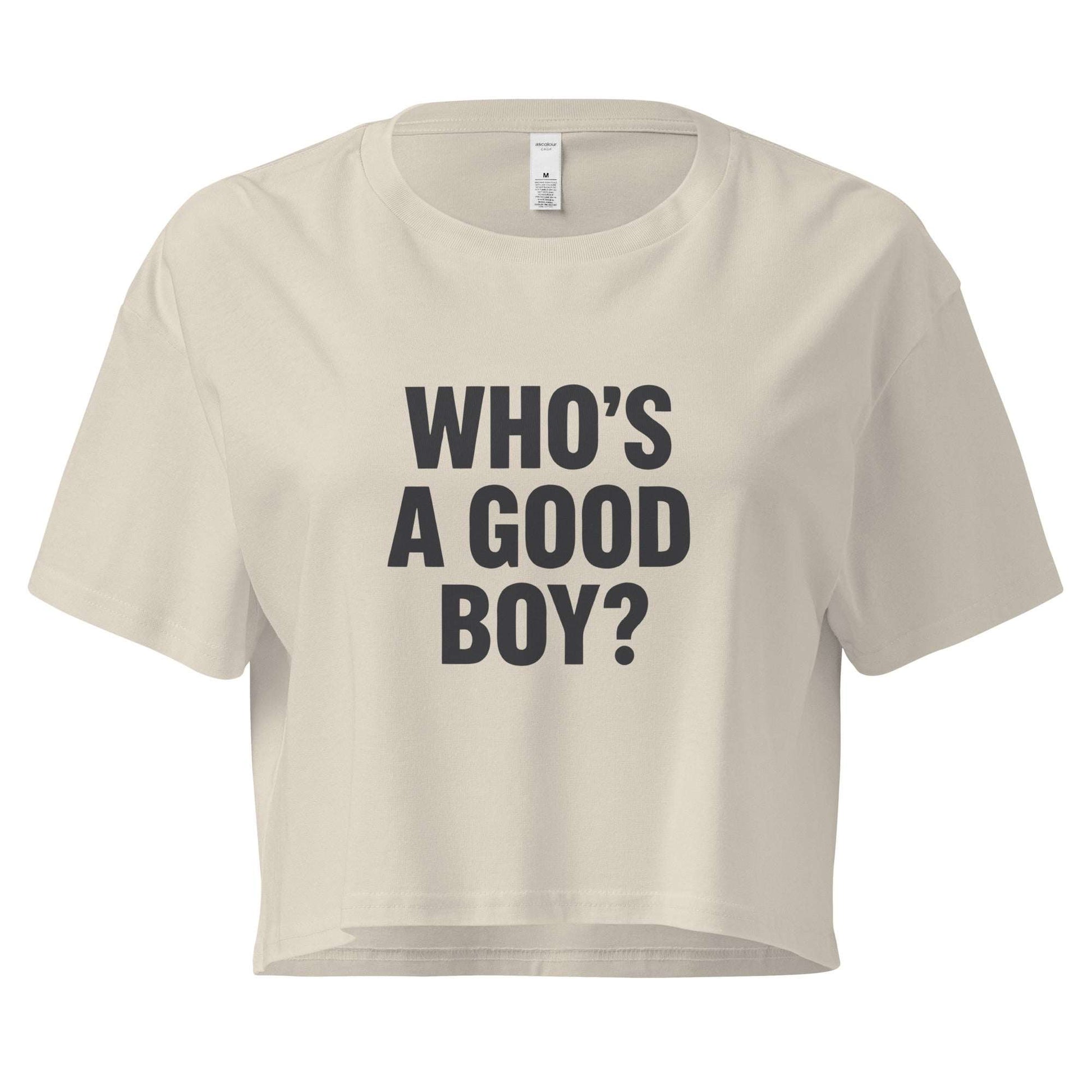 Beige crop top with 'WHO'S A GOOD BOY?' text on a white background