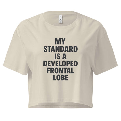 Beige crop top with black text on a white background