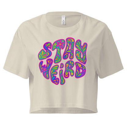 Beige crop top with colorful 'Stay Weird' text design on a white background
