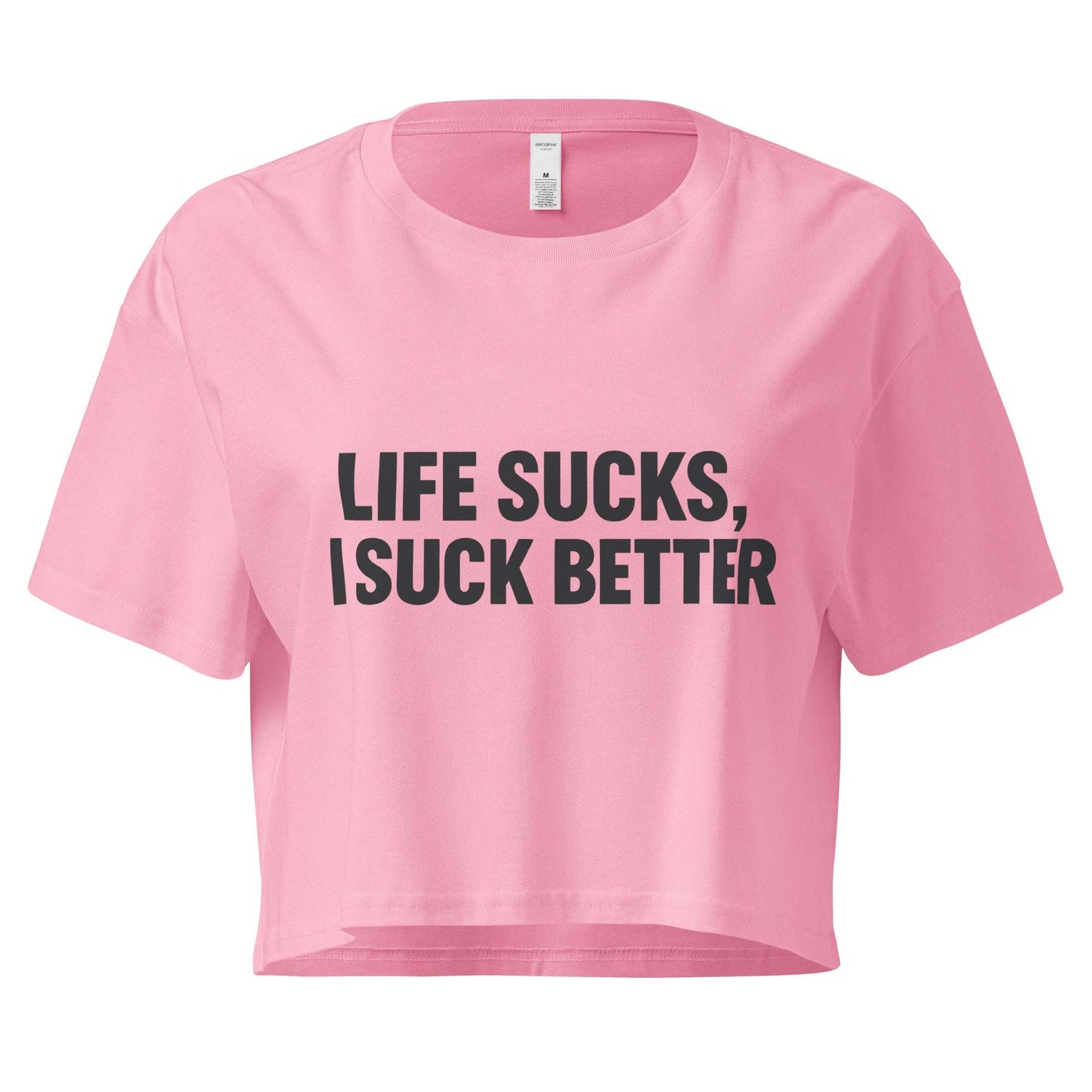Pink crop top with black text 'LIFE SUCKS, I SUCK BETTER' on a white background