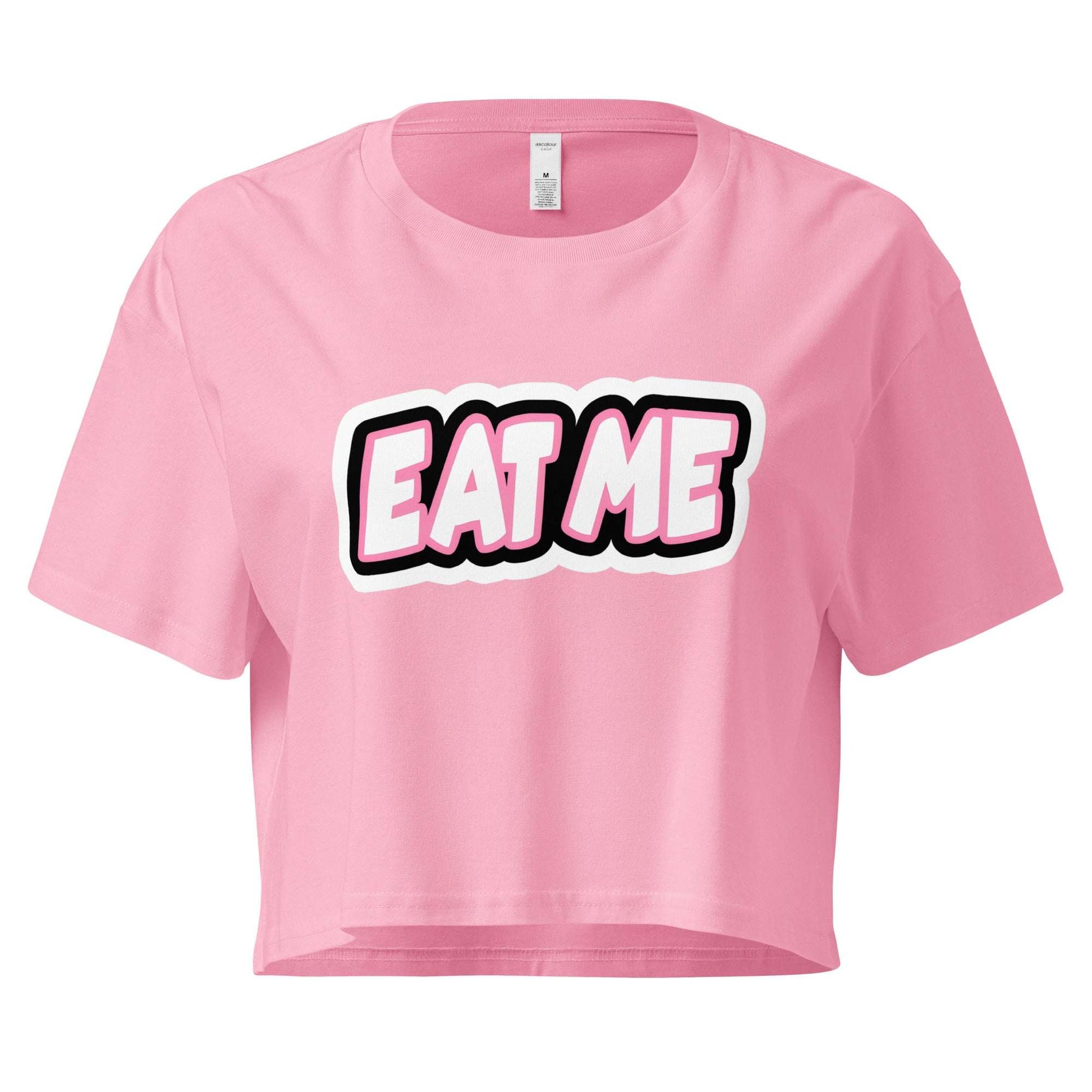 Pink crop top with 'EAT ME' text on a white background