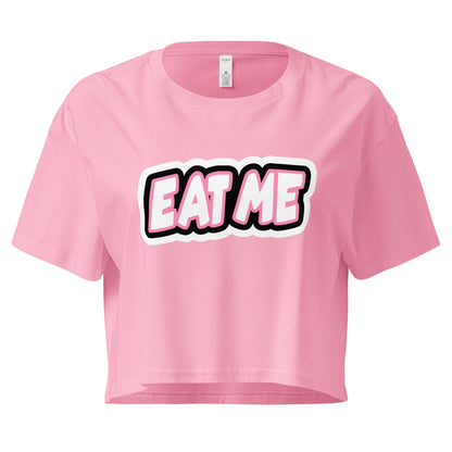 Pink crop top with 'EAT ME' text on a white background
