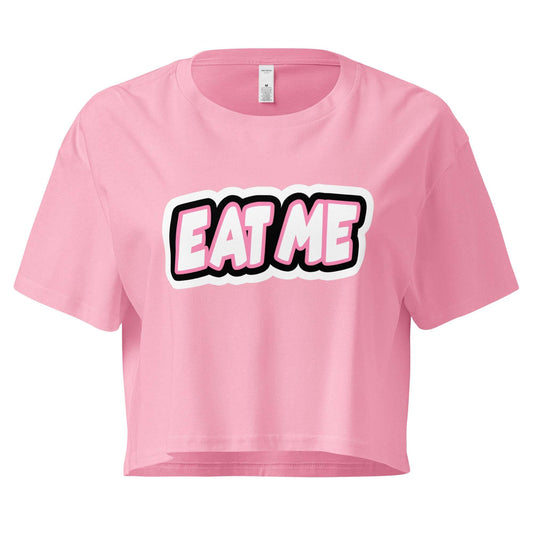 Pink crop top with 'EAT ME' text on a white background