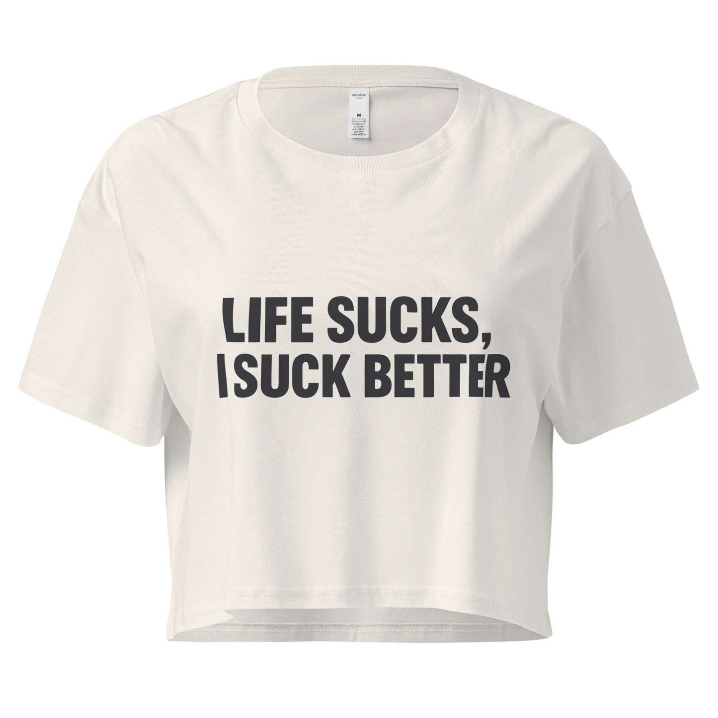 White crop top with black text 'LIFE SUCKS, I SUCK BETTER' on a white background