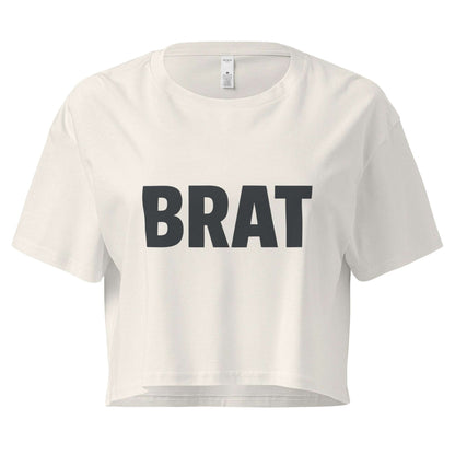 White crop top with 'BRAT' printed in black on a white background