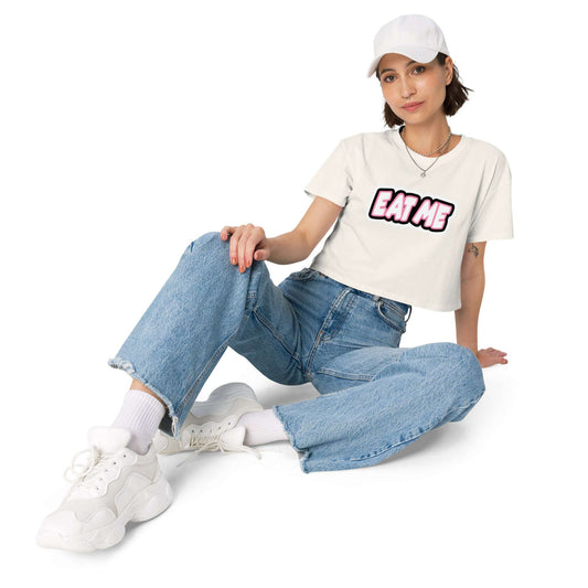 Person wearing a white t-shirt with a graphic design and text, sitting on a white background