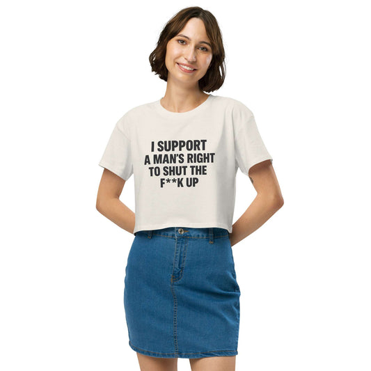 Person wearing a white t-shirt with text and a blue skirt on a white background