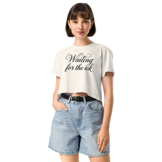 Woman wearing a white t-shirt with text and denim shorts on a white background