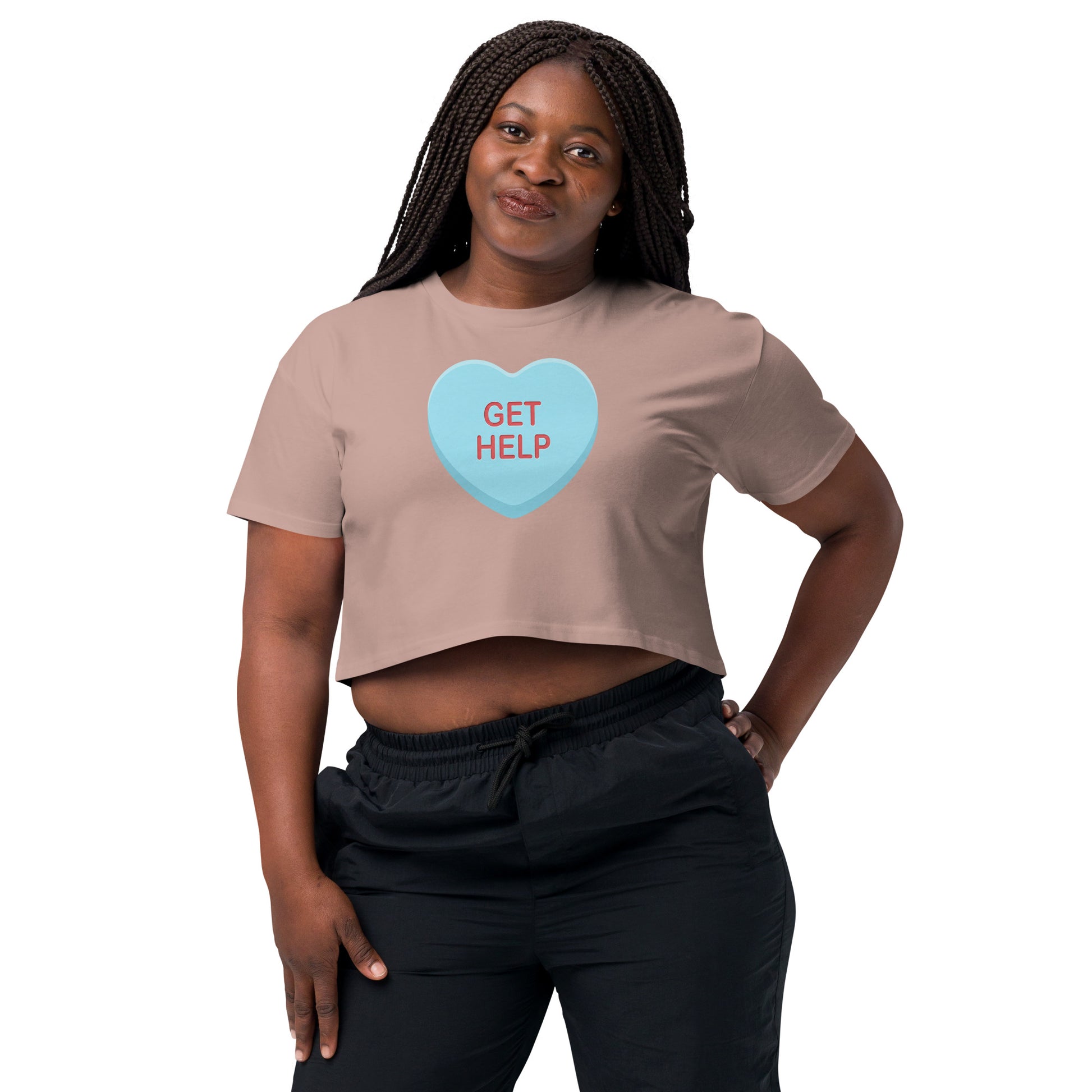 Woman wearing a beige t-shirt with a colorful graphic design on a white background