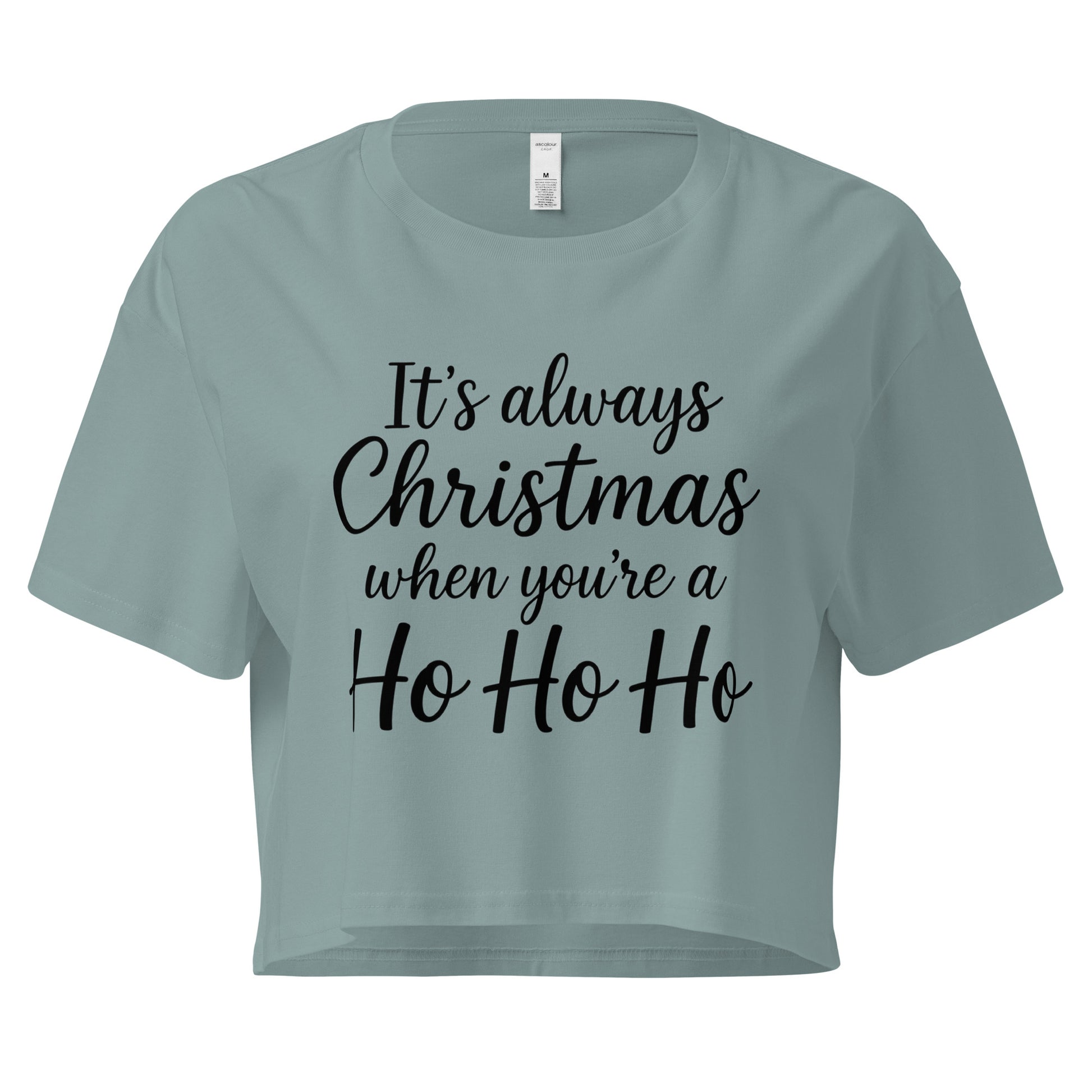 Women’s sage green crop top with black “It’s always Christmas when you’re a Ho Ho Ho” text design in ChibiChibi style.