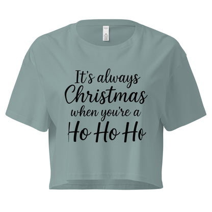 Women’s sage green crop top with black “It’s always Christmas when you’re a Ho Ho Ho” text design in ChibiChibi style.