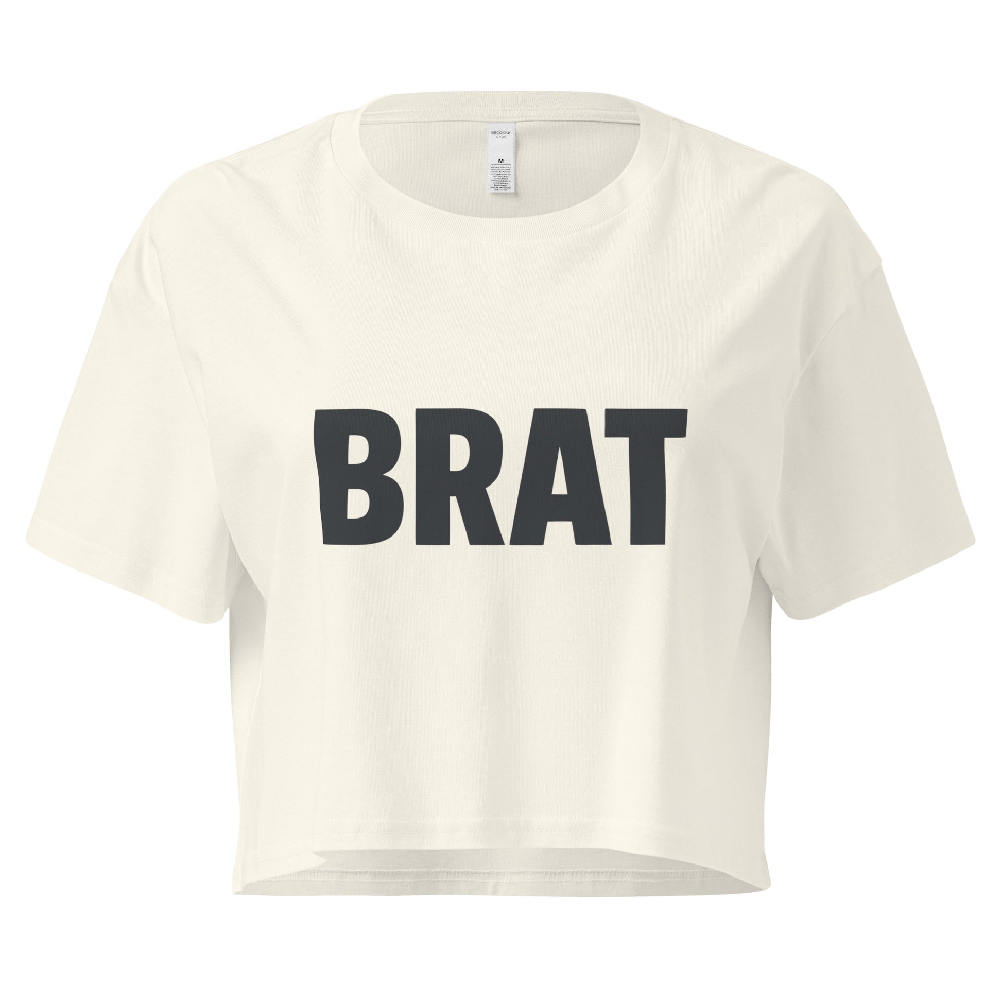 White crop top with 'BRAT' printed in black on a white background