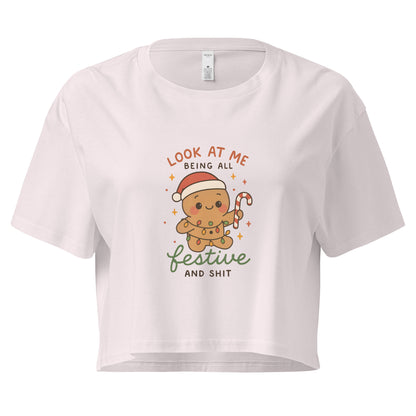 Women’s loose crop top with cute gingerbread “Festive and Shit” Christmas design in ChibiChibi style.