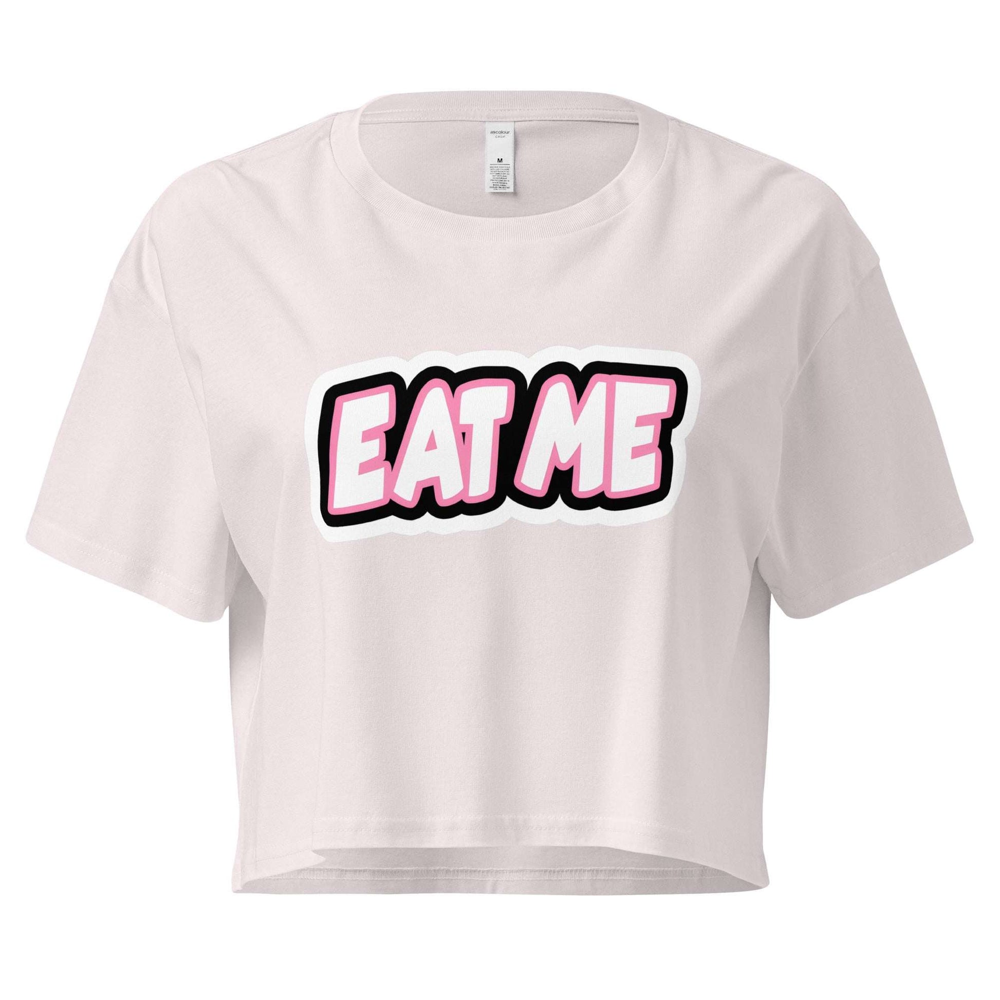 White crop top with 'EAT ME' text on a white background