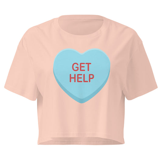 Pink t-shirt with a blue heart-shaped candy and 'GET HELP' text on a white background