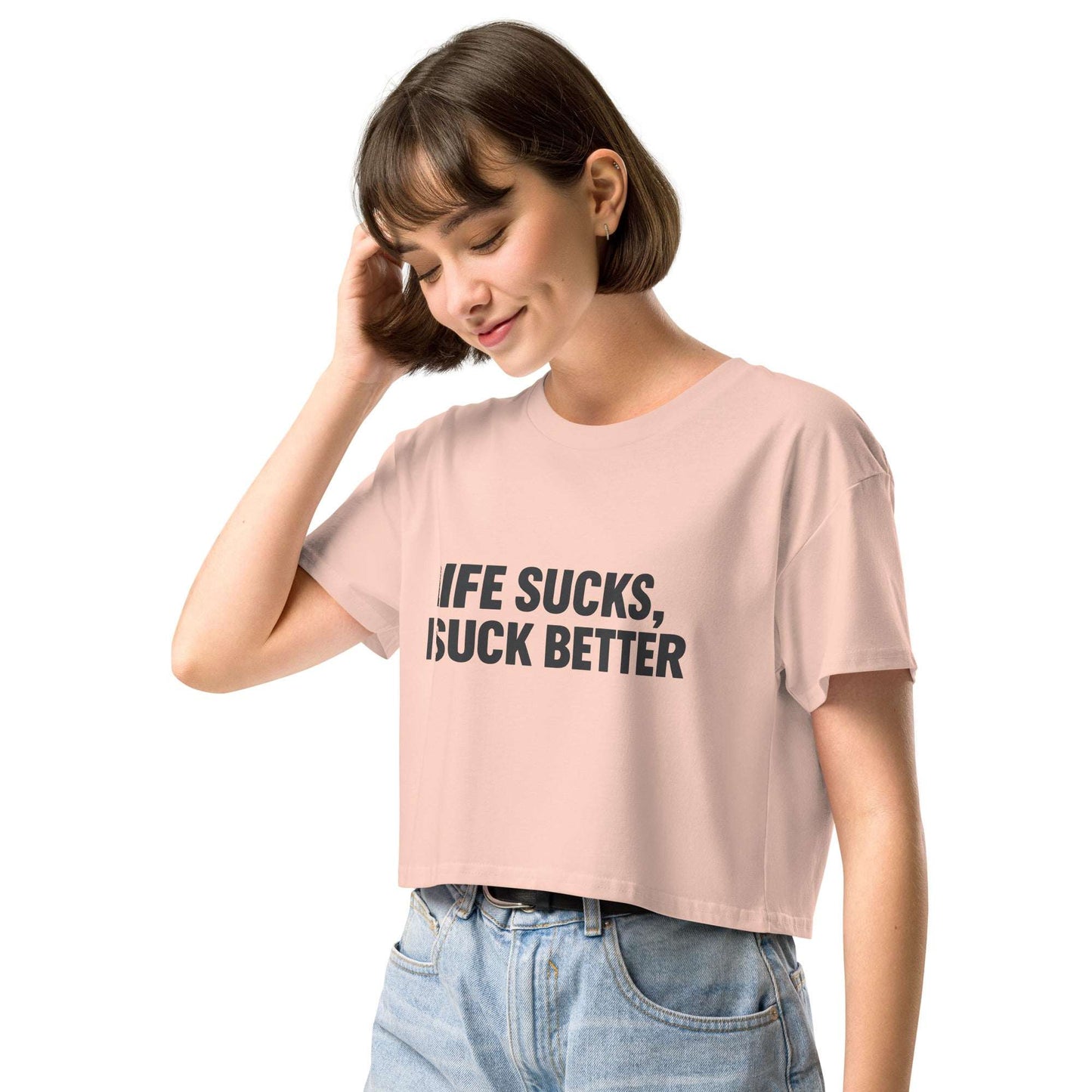 Person wearing a pink t-shirt with text on a white background